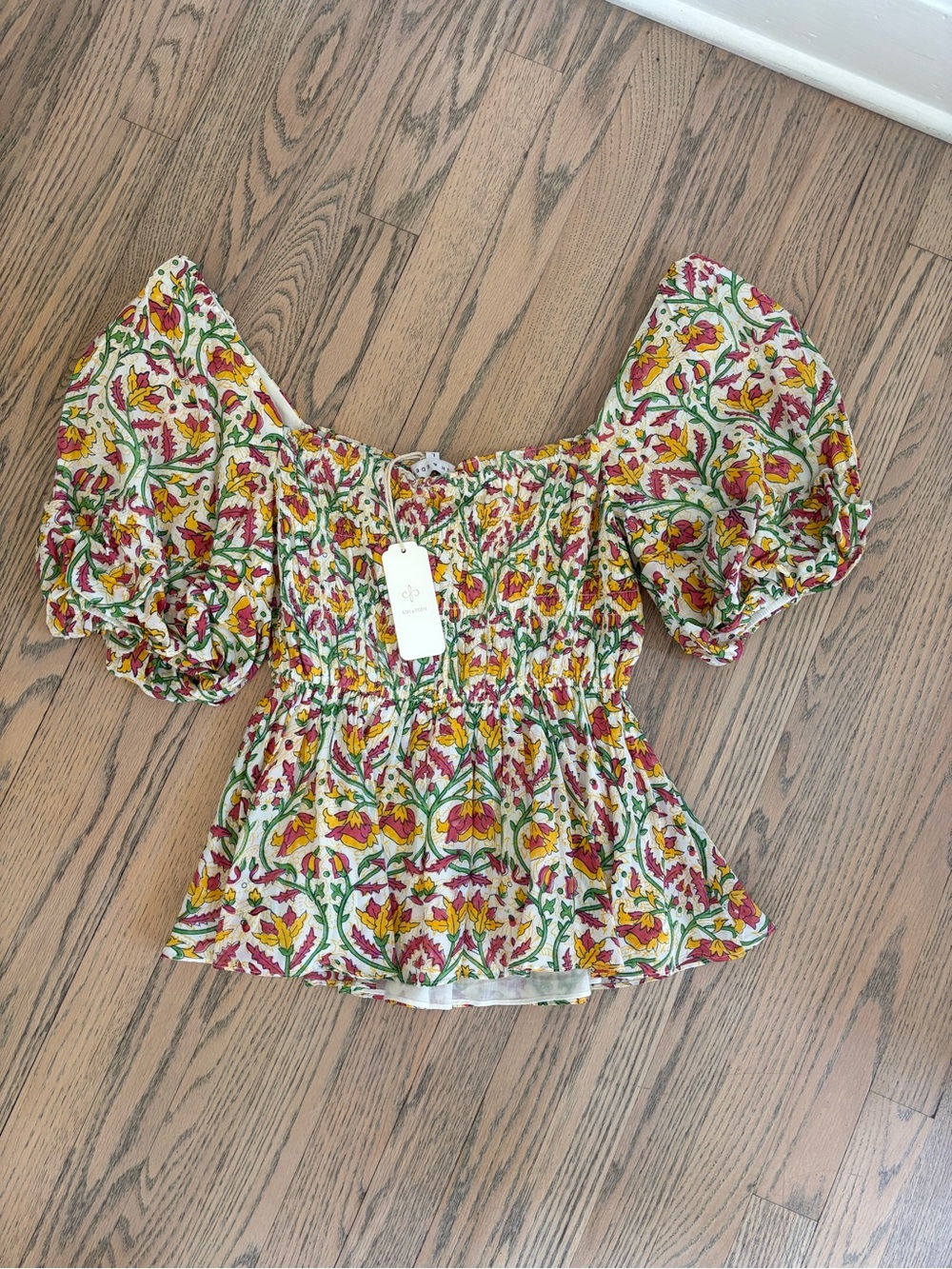 NWT Smocked Floral peplum puff -Sleeve Top